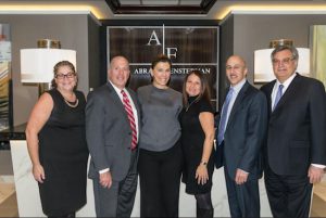 The law firm of Abrams and Fensterman has positioned itself as potentially the biggest Brooklyn law firm as it has absorbed four new firms and moved into a new office in MetroTech this month. Pictured from left: Rachel Demarest Gold, Mark Caruso, RoseAnn C. Branda, Susan Mauro, Michael A. Coscia and Lawrence F. DiGiovanna. Eagle photos by Rob Abruzzese