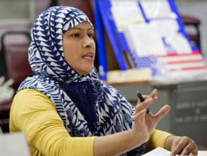 Election worker Rozina Akter talks with a voter on Election Day in Borough Park. Akter, a Muslim, is originally from Bangladesh. AP Photo/Mark Lennihan