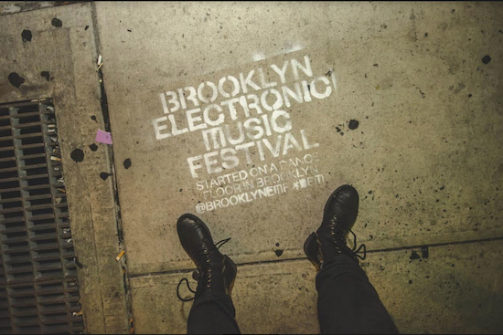 A BEMF logo is painted on a Brooklyn sidewalk. Photo by Tiffany Rexach