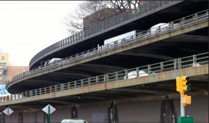 Traffic on the busy Brooklyn-Queens Expressway (BQE) runs along two decks — one Queens-bound, one Staten Island-bound — as it passes through Brooklyn Heights. Photo courtesy of NYC DOT