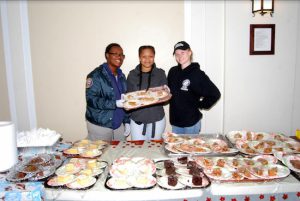 Police and volunteers standing by dessert table. Eagle photos by Arthur De Gaeta