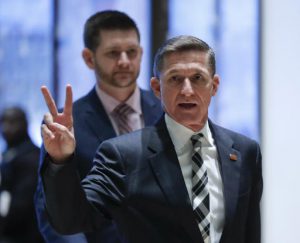 Retired Lt. Gen Michael Flynn gestures as he arrives at Trump Tower, Thursday in New York City. AP Photo by Carolyn Kaster
