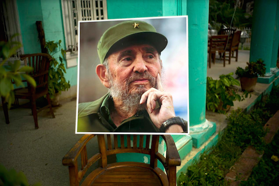 An image of the late Fidel Castro stands on a chair in a government building in Havana on Sunday, Nov. 27. Cuba is observing nine days of mourning for the former president who ruled Cuba for half a century. AP Photo/Ramon Espinosa