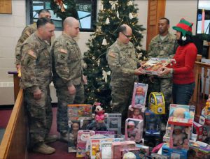 Assemblymember Nicole Malliotakis presents toys to military service members at the U.S. Army Garrison at Fort Hamilton last year. Photo courtesy of Malliotakis’s office