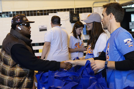 NY Mets staffers meet residents at Brooklyn Community Services Seth Low Cornerstone Community Center while handing out Thanksgiving turkeys. Photos courtesy of Jelani Thomas