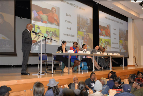 Brooklyn Borough President Eric Adams, at microphone, addresses the NYCHA Town Hall at UnCommon High School in Crown Heights. At the table on the dais were, from left, Deputy Brooklyn Borough President Diana Reyna, NYCHA Chair and CEO Shola Olatoye, City Councilmember Ritchie Torres, and NYCHA executives Luis Ponce, Gerald Nelson and Sideya Sherman Photo by Stefan Ringel/Brooklyn Borough President's Office