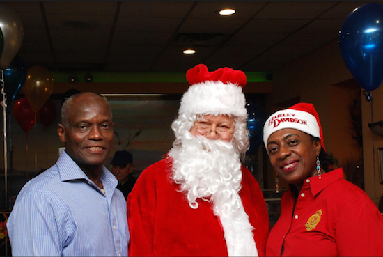 President of Friends of Barbados Trevor Messiah (left) with Santa Claus and Judy Newton, president of the Newton Foundation. Eagle photos by Arthur De Gaeta