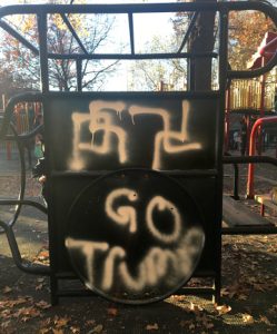 The Parks Department is scrubbing multiple swastikas and the message “Go Trump!” off the play equipment at Adam Yauch Park in Brooklyn Heights. The ugly graffiti was just one of several incidents in the city since the presidential election last week. Photo courtesy of state Sen. Daniel Squadron