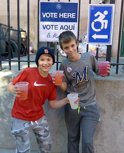 Karsten Cole (left) and Warner Gephardt sold lemonade at packed polling place P.S. 8 in Brooklyn Heights and told the Brooklyn Eagle that they firmly supported Hillary Clinton. Photo by Mary Frost