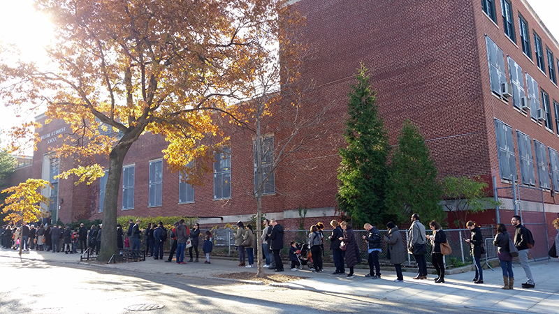 A long line of voters stretched the length of the block on Fourth Street outside the polling place at M.S. 51 in Park Slope Tuesday morning. One voter who emerged from the school at 9:40 a.m. told the Eagle she had waited on line an hour and a half to vote.  Eagle photo by James Harney