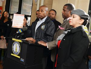 Following several horrific fires, officials want Gov. Andrew Cuomo to provide funds for a burn center in Brooklyn. Shown: Borough President Eric Adams, center, alongside Brownsville residents and officials including state Sens. Jesse Hamilton (third from right) and Kevin Parker (second from right), visited the community center of NYCHA’s Howard Houses two days after the development suffered a deadly fire.  Photo by Erica Sherman/Brooklyn BP’s Office