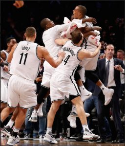 Randy Foye is hoisted by his happy teammates after nailing a buzzer-beating 3-pointer that lifted the Nets to a dramatic 120-118 victory over the visiting Charlotte Hornets at Downtown’s Barclays Center on Monday night. AP photo