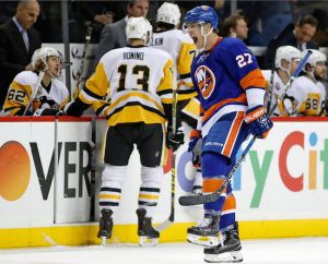 Anders Lee skates by the Pittsburgh bench while celebrating his go-ahead goal in the final half-minute of the Islanders’ 5-3 victory over the defending Stanley Cup champions at Downtown’s Barclays Center on Wednesday night. AP photo