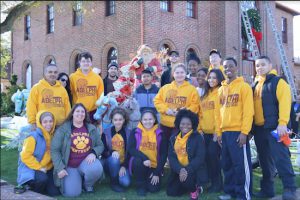 Students helped build the holiday display outside the Neponsit Beach home of Joseph Mure Jr. for a charity event he sponsors every year. Photos courtesy of Adelphi Academy of Brooklyn