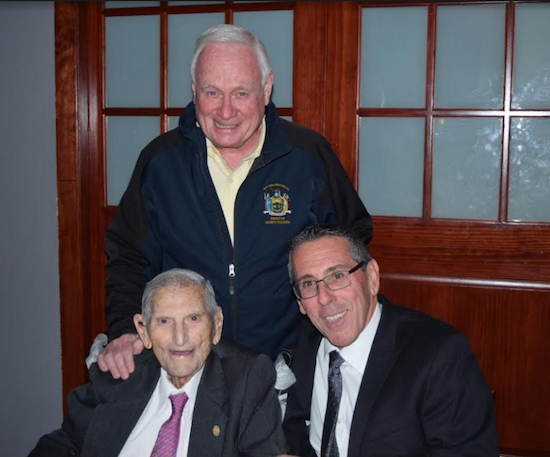 Carl Tavolacci (sitting, left) with President of the Bay Ridge Lawyers Association (BRLA) Steve Spinelli (right) and state Sen. Marty Golden (standing) during a recent BRLA meeting this past September. Eagle photo by Rob Abruzzese