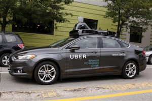 A self driving Uber car drives Liberty Ave. through the Bloomfield neighborhood of Pittsburgh. AP Photo/Gene J. Puskar