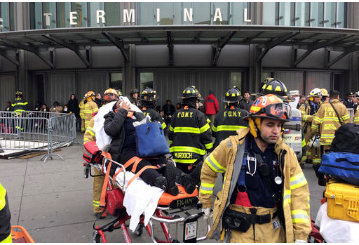 An injured passenger, after a Long Island Rail Road commuter train either hit something or derailed, is taken from the Atlantic Terminal, in the Brooklyn borough of New York, Wednesday, Jan. 4, 2017. AP Photo/Mark Lennihan
