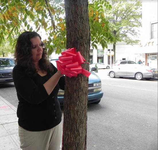 Josephine Beckmann, district manager of Community Board 10, shown taking part in a Red Ribbon Campaign in 2014 to raise awareness of drug abuse, will receive a community service award. Eagle file photo by Paula Katinas