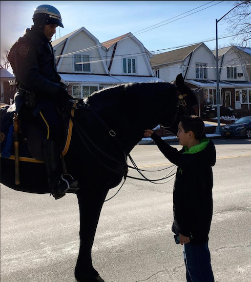 NYPD Mounted Unit Officer Ramos introduces a young Brooklyn boy to Pompeii. Eagle photos by John Alexander