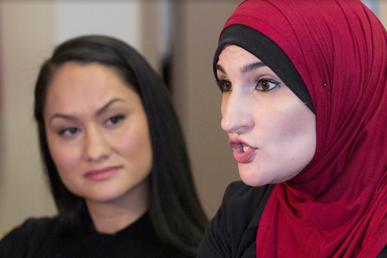 Linda Sarsour, right, and Carmen Perez, co-chairs of the Women's March on Washington, speak during an interview on Jan. 9. In the days since Sarsour helped organize the march on Washington the day after Donald Trump's inauguration, the Brooklyn-born, hijab-wearing activist has been targeted on the internet by false reports that she supports Islamic State militants and favors replacing the U.S. legal system with Islamic religious law. AP Photo/Mark Lennihan, File