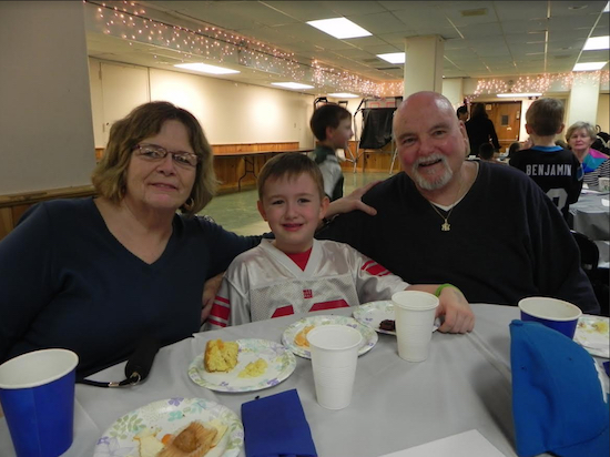 Justin Kearney invited his grandparents, Anita and Gerard Kearney, to the Junior/Senior Tea at Saint Anselm Catholic Academy last year. Eagle file photo by Paula Katinas