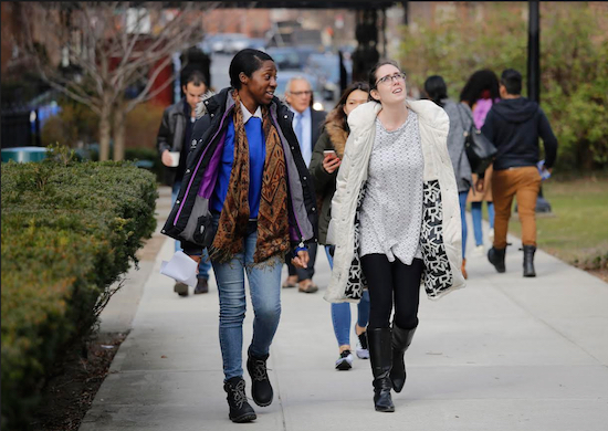 Brooklyn College students walk between classes on campus. AP Photos/Bebeto Matthews