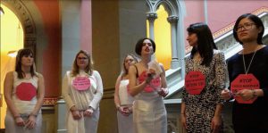 In this image taken from video, women in chains protest against child marriage on Tuesday at the Capitol in Albany. AP Photo/Anna Gronewold