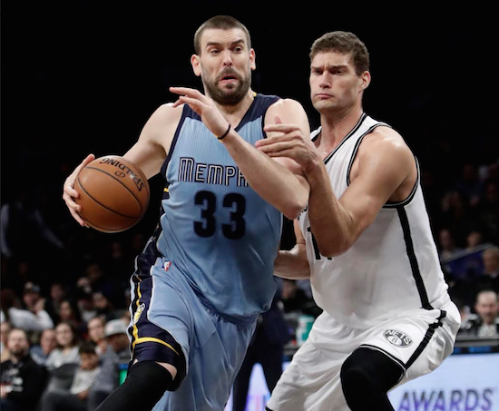 Memphis forward Marc Gasol powers past Brook Lopez Monday night in Downtown Brooklyn as the Nets suffered their franchise-record 15th consecutive home loss. AP Photo by Frank Franklin II