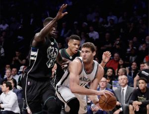 Brook Lopez enjoyed a historic performance Wednesday night at Downtown’s Barclays Center, but the Bucks proved too tough an opponent as Brooklyn lost its 14th straight game. AP photo
