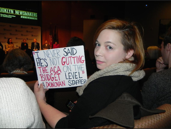 Mallory McMahon, a member of the group Fight Back Bay Ridge, attended the Feb. 6 Brooklyn Chamber of Commerce Forum where she and several others protested U.S. Rep. Dan Donovan’s stance on the recent order banning immigrants from seven predominantly Muslim countries from entering the U.S. Eagle photo by Paula Katinas
