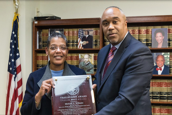 U.S. Attorney for the EDNY Robert Capers presents Dr. Michelle A. Williams with the 2017 Trailblazer Award, given out every year during Black History Month. Eagle photos by Rob Abruzzese
