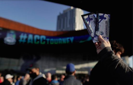 A Syracuse fan holds up tickets for sale outside the Barclays Center after a quarterfinal round NCAA college basketball game in the Atlantic Coast Conference tournament, Thursday, March 9, 2017, in New York. AP Photo/Julie Jacobson