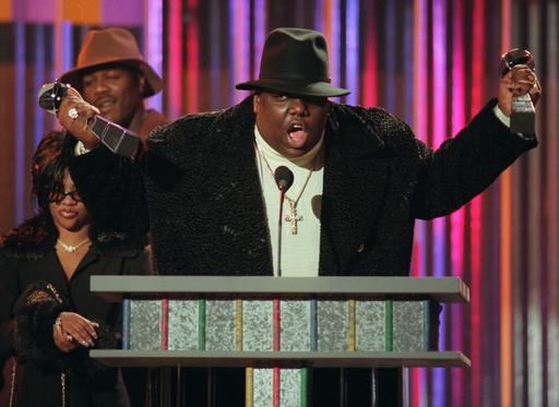 FILE - In this Dec. 6, 1995, file photo, The Notorious B.I.G., who won rap artist and rap single of the year, clutches his awards at the podium during the annual Billboard Music Awards in New York, in this Dec. 6, 1995 file photo. AP Photo/Mark Lennihan, File