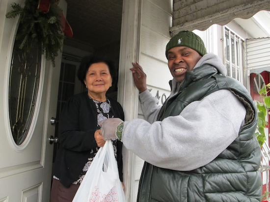 A deliverer from Citymeals on Wheels brings a meal to a neighbor. Photo courtesy of Citymeals on Wheels