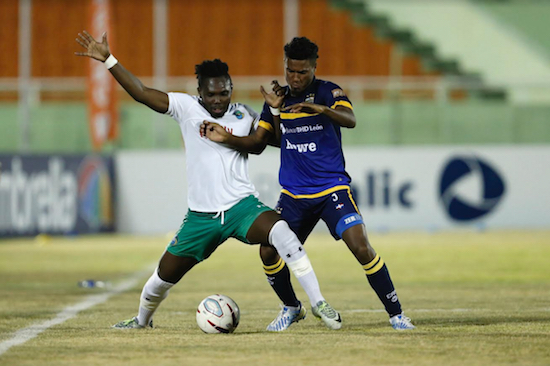 The New York Cosmos can’t seem to get enough of island life these days. The team announced Wednesday that it would be traveling to Bermuda on March 19 to play the Bermuda Football Federation National Team in an international exhibition match. Shown: Kalif Alhassan (in white) fights off a defender during an exhibition match in the Dominican Republic. Photo courtesy of Atlético Pantoja