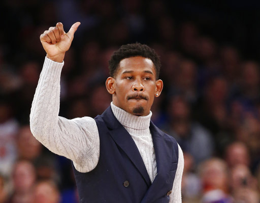 FILE - In this Jan. 9, 2017, file photo, WBA middleweight boxing champion Danny Jacobs acknowledges the crowd during a timeout in the first half of an NBA basketball game between the New York Knicks and the New Orleans Pelicans at Madison Square Garden in New York. The WBA champion is a decided underdog for the unification fight Saturday, March 18, 2017, at Madison Square Garden. AP Photo/Kathy Willens, File