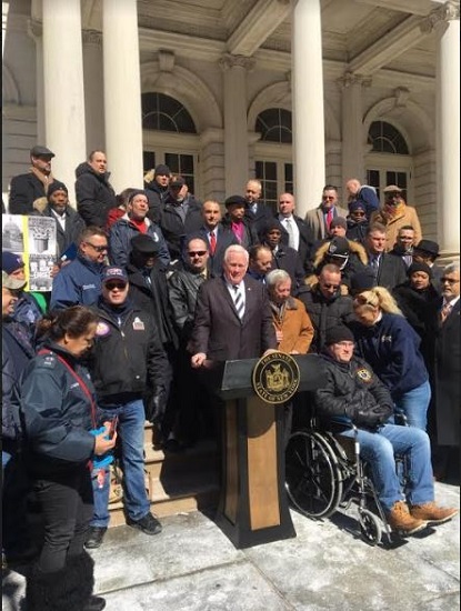 State Sen. Marty Golden (at podium) says the bill that he and Assemblymember Peter Abbate are pushing would help to ease the stress on public employees when they apply for disability pensions. Photo courtesy of Golden’s office