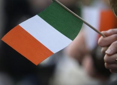 A New Yorker proudly waves an Irish flag for a little bit of “Ireland over here.” AP/Press Association Images