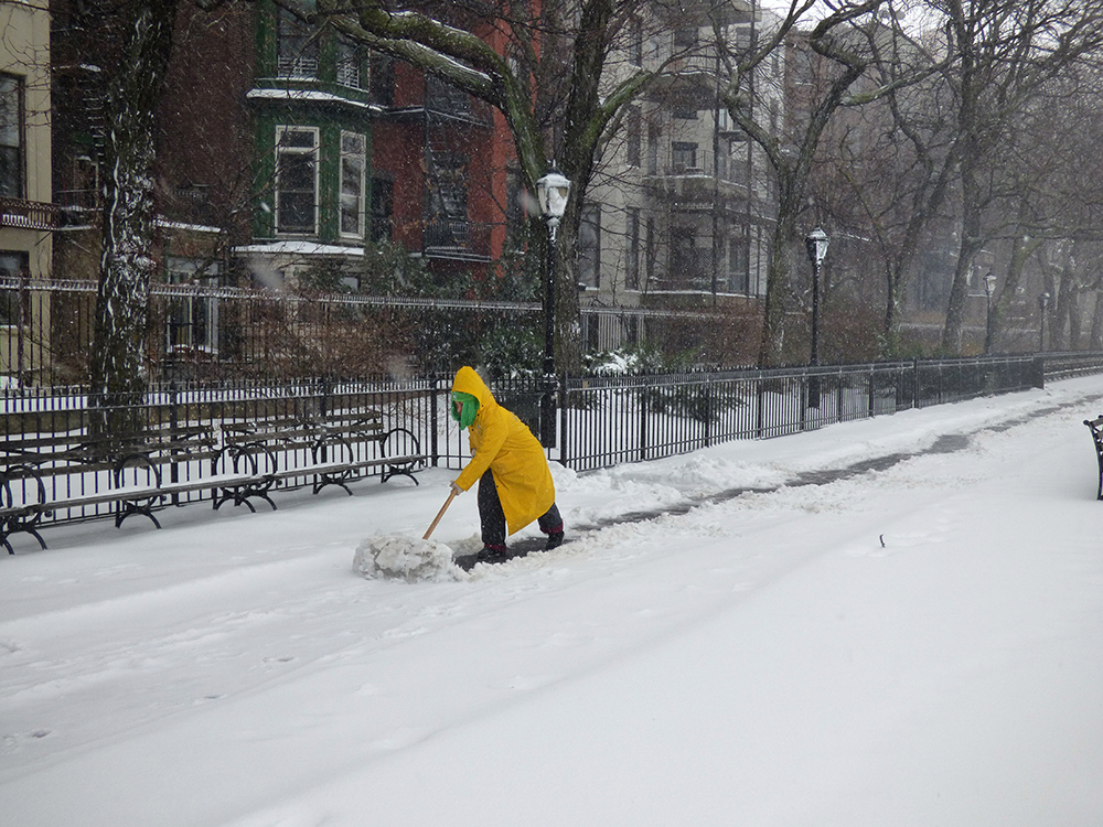 Angel McClean, an amazing Parks Department worker, takes on the Promenade in the midst of the storm.