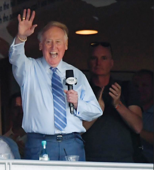 In this Oct. 20, 2016 file photo, Vin Scully acknowledges the crowd from a box before Game 5 of the National League baseball championship series between the Chicago Cubs and the Los Angeles Dodgers in Los Angeles. AP Photo/Mark J. Terrill, File