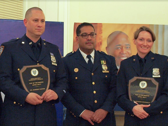 Officers Robert Faivre and Maureen Stefenelli receive the honorary Officer of the Month award at the 84th Precinct Community Council Meeting for saving a woman from jumping off the Brooklyn Bridge. Pictured from left: Robert Faivre, Capt. Roberto Melendez, and Maureen Stefenelli. Photos by Paul Frangipane