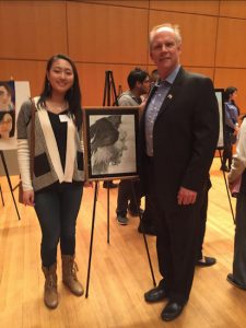 Carrie Guan, a 2016 contestant, showed her artwork to U.S. Rep. Dan Donovan. Photo courtesy of Bishop Kearney High School