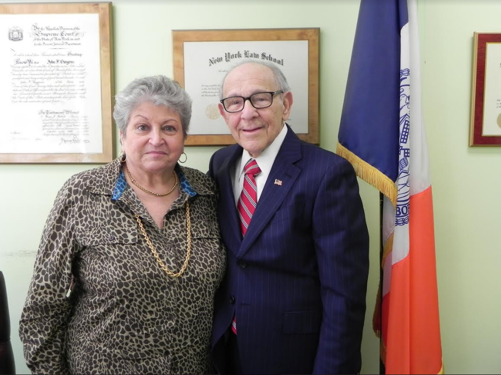 John Gangemi and wife Barbara work together in a Bay Ridge office decorated with dozens of photos of their children and grandchildren. Eagle file photo by Paula Katinas