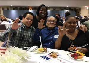 World War II veteran Harold Simmons (center) is surrounded by his family. From left: Curtis Simmons, Cassandra Simmons and Sharon Simmons. Eagle photos by John Alexander