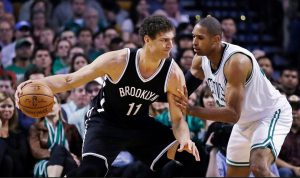 Brook Lopez moves toward the basket in pursuit of becoming the Nets’ all-time leading scorer, a goal he accomplished Monday night in Boston. AP Photo by Charles Krupa