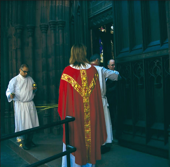 Thurifer Matthew Burdette, celebrant the Rev. Katherine Salisbury and rector Fr. John Denaro (partially obscured) enter the sanctuary for the first Sunday following a nine-month repair closure. Eagle photo by Francesca N. Tate