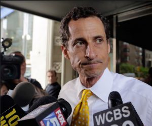 In this July 24, 2013, file photo, former Democratic U.S. Rep. Anthony Weiner leaves his apartment building in New York. Weiner will appear in federal court, Friday, May 19, 2017, to face criminal charges in an investigation of his online communications with a teenage girl in North Carolina. AP Photo/Richard Drew, File