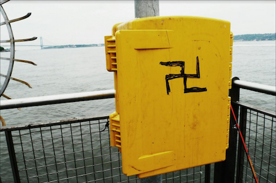 A hate symbol was found scrawled on a utility box at the edge of the American Veterans Memorial Pier at 69th Street in Bay Ridge. Photos courtesy of John Quaglione