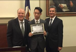 Benny He (center), of Stuyvesant High School in Manhattan, won the annual essay contest hosted by Appellate Division Justice Robert J. Miller (left), Justice Michael J. Garcia (right), and the New York Law Journal. Eagle photos by Ahmed Jallow