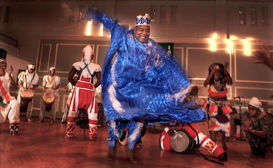 In this Jan 1, 2004 photo, Chuck Davis dances with members of The African American Dance Ensemble during the 18th Annual KwanzaaFest in Durham, N.C. Davis, a master choreographer and teacher of traditional African dance styles who founded dance companies in North Carolina and New York, died Sunday, May 14 at his Durham home. He was 80. Corey Lowenstein/The News & Observer via AP